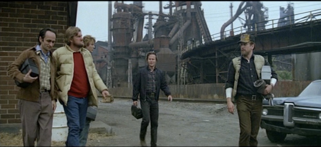 The friends leaving the steel mill.